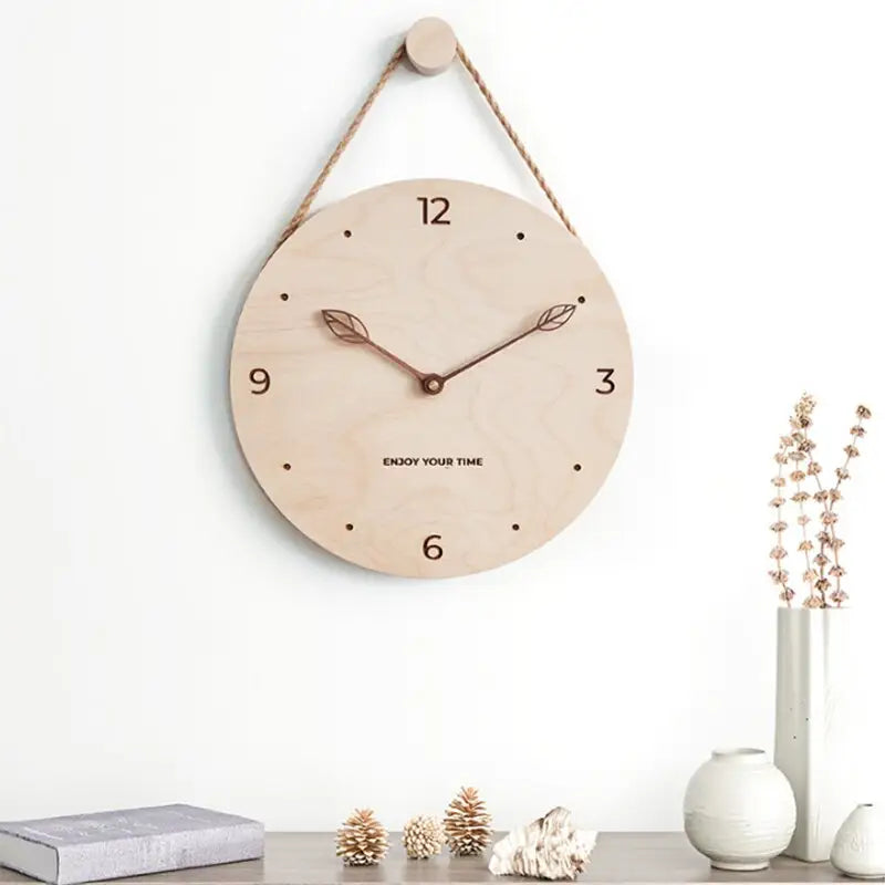 Minimalist birch and black walnut wall clock in leaf style