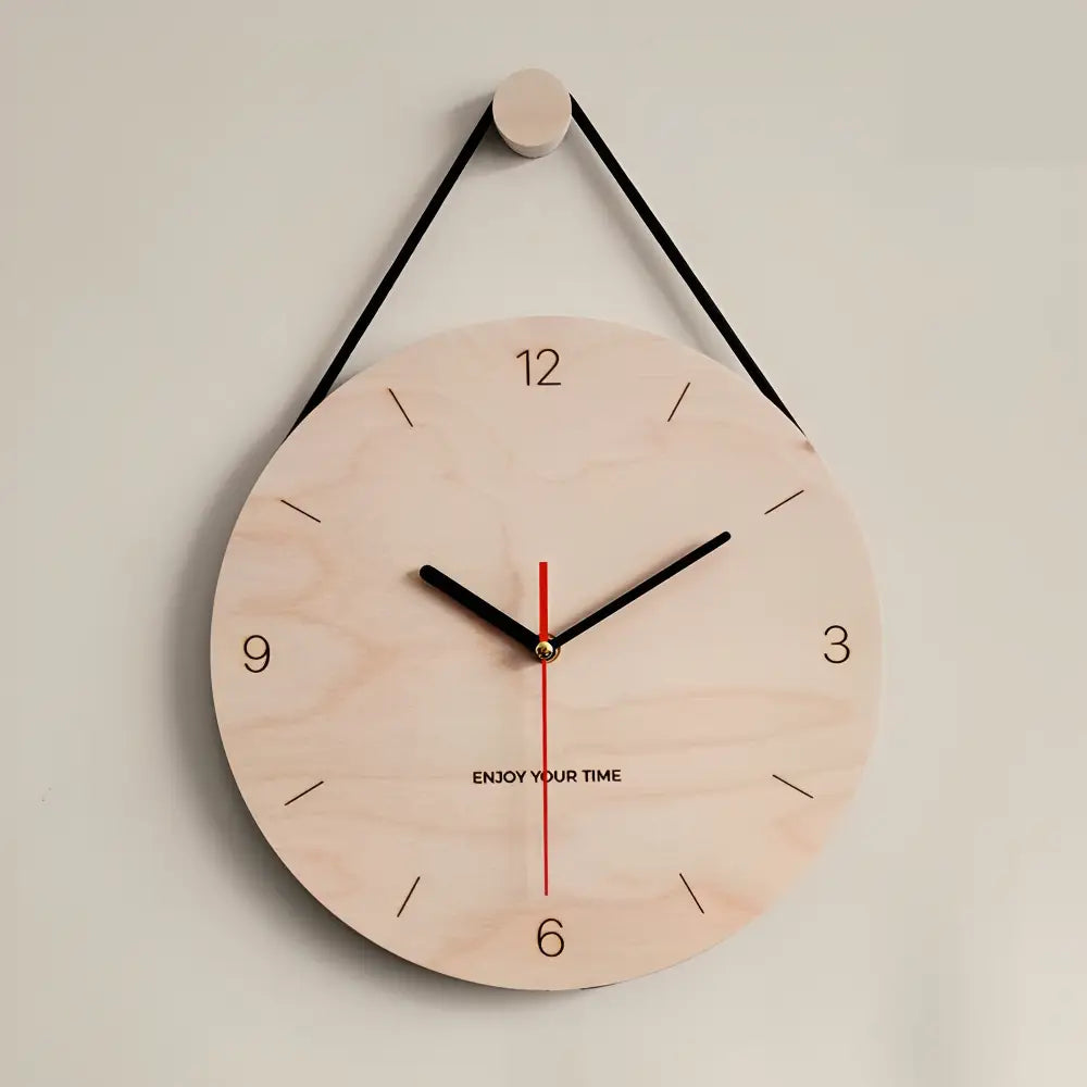 Lightweight birch wall clock showing clear numeral dial and slim profile