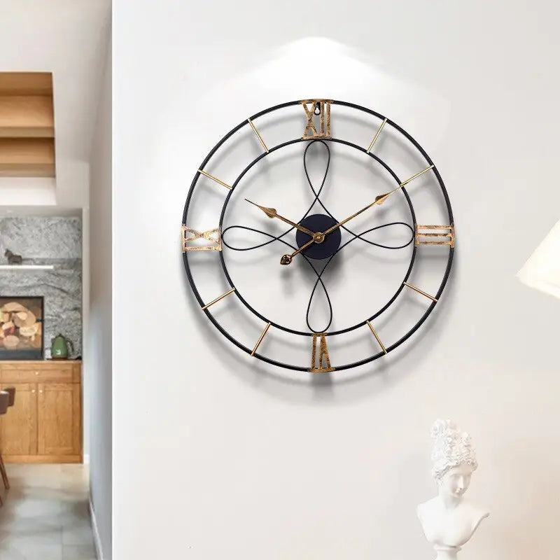 Close-up of infinity pattern motif on black and gold metal wall clock