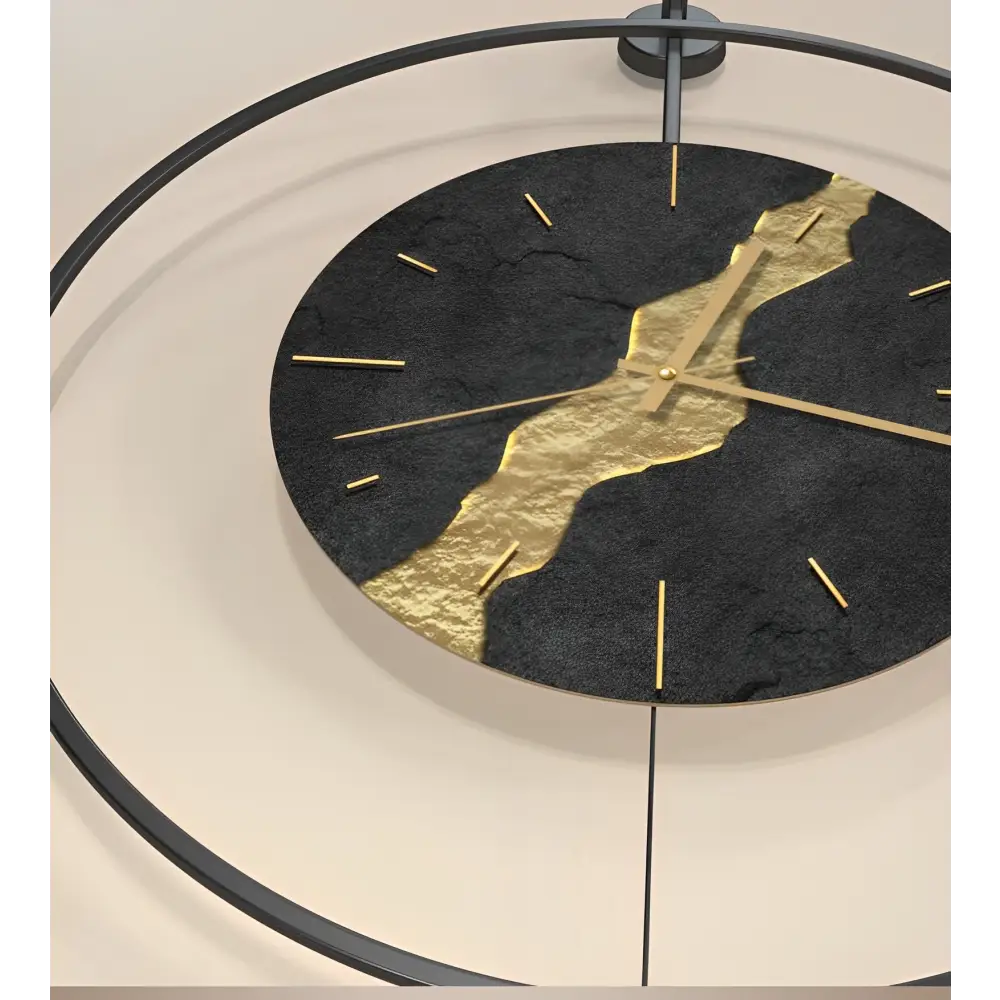 Black and gold Kintsugi metal wall clock with abstract pattern on white wall