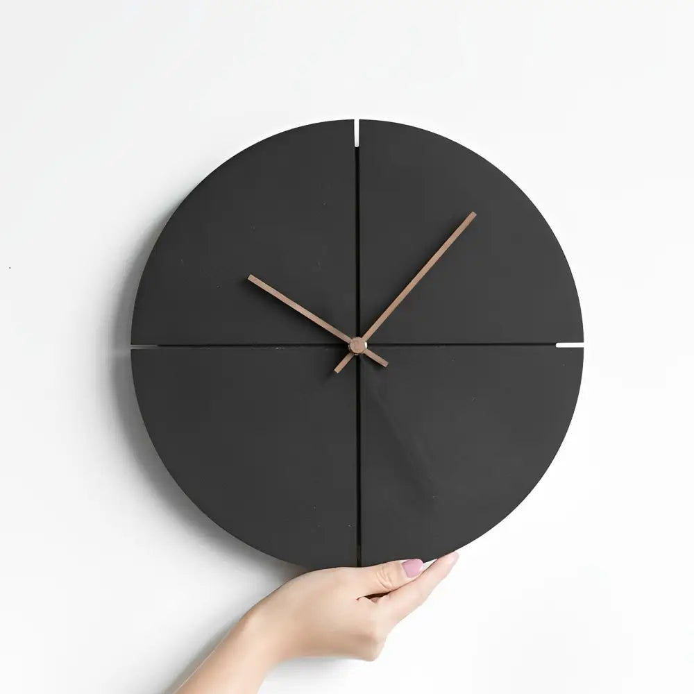Close-up of analog hand display on black Nordic wooden wall clock