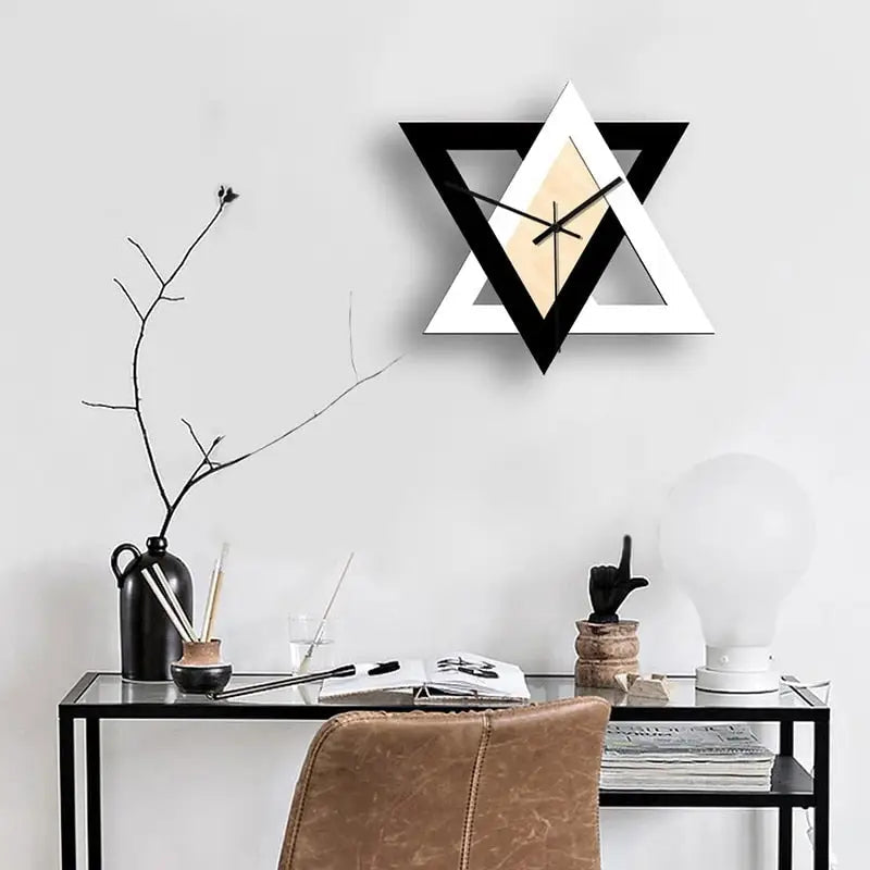 Close-up of triangle clock face showing analog hands and minimalist numerals