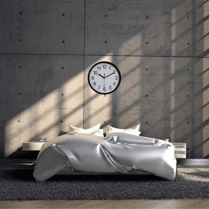 White classic wall clock with clean minimalist face and quartz movement