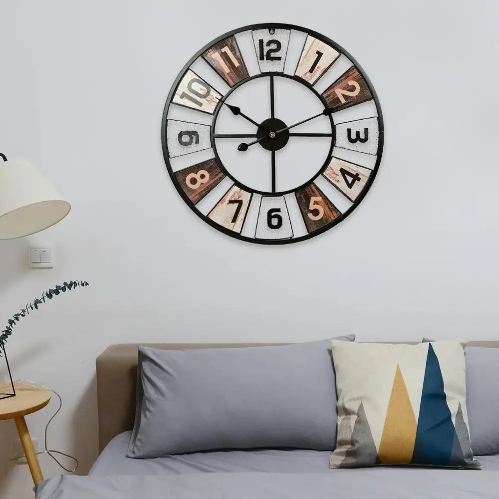 Colorful industrial wall clock displayed in a cafe interior setting