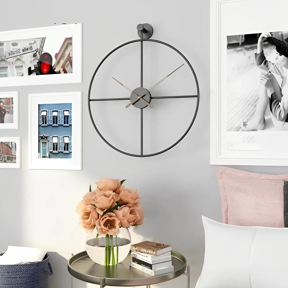 Gold crossed circle modern wall clock close-up showing analog hands and quartz movement