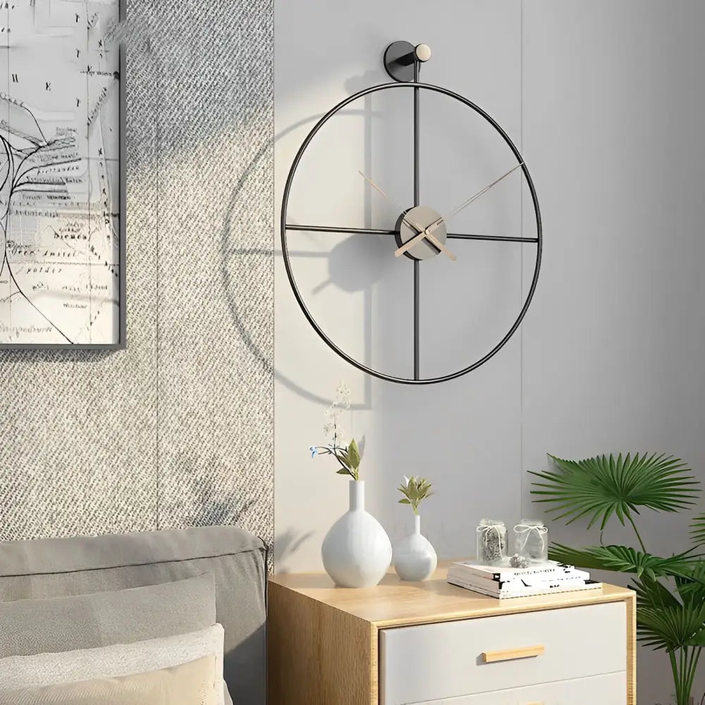 Crossed circle wall clock gold finish detail showing metal construction