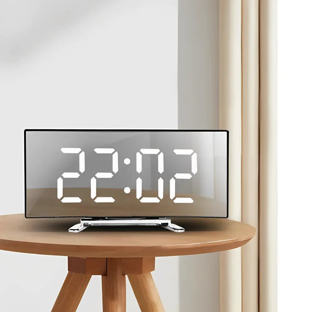 Close-up of curved LED display with calendar and thermometer readout