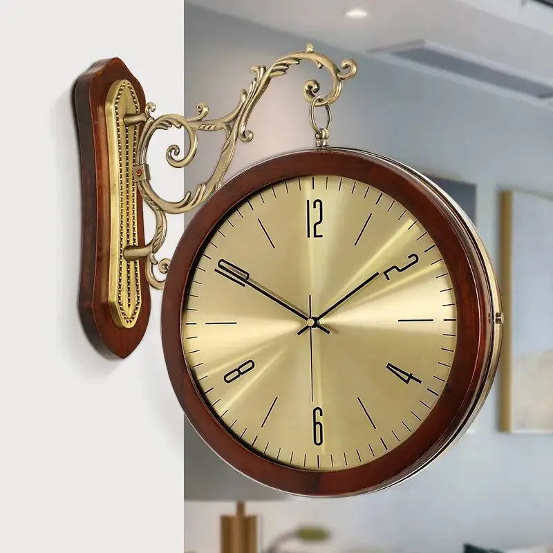 Front face of vintage wall clock showing metal dial and analog hands