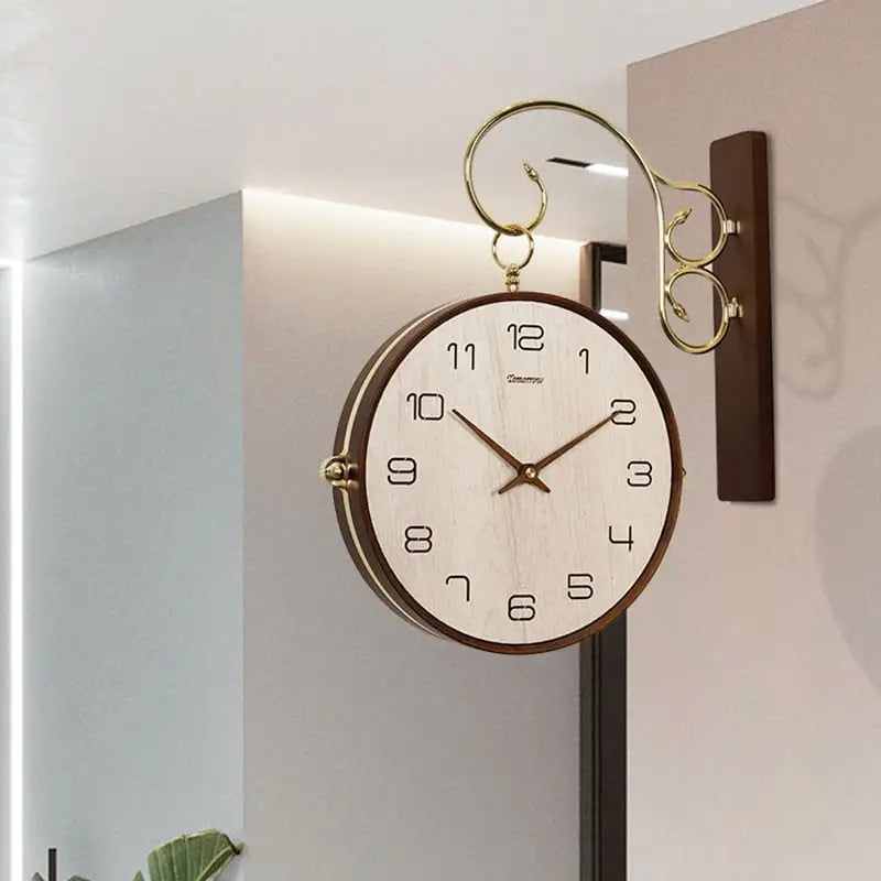 Two-face wall clock showing both clock faces in a living room setting