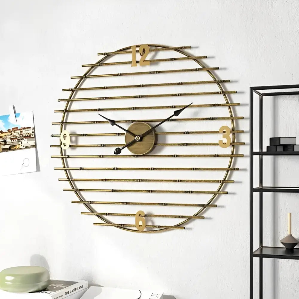 close-up of gold metal clock face showing numerals at 3 6 9 and 12