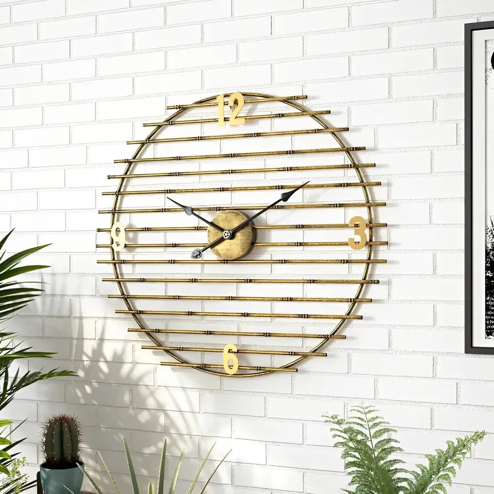 large gold wall clock displayed in a modern living room setting