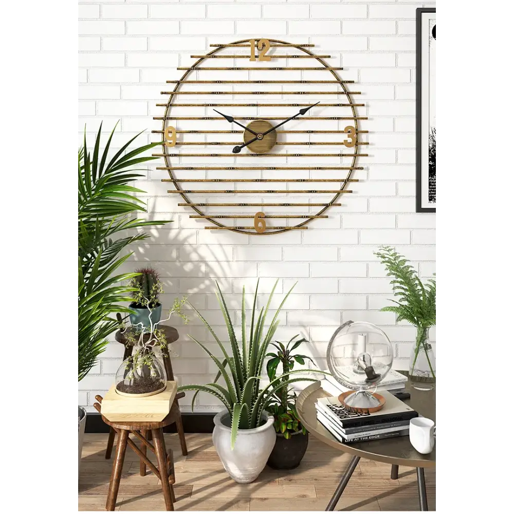 gold metal wall clock analog hands detail shot