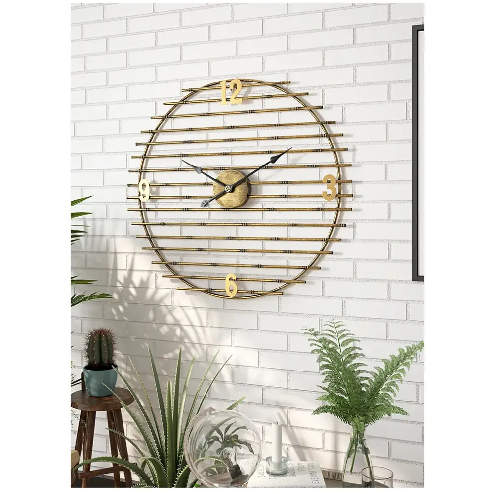 20 inch decorative gold clock hung above a sofa in a contemporary interior