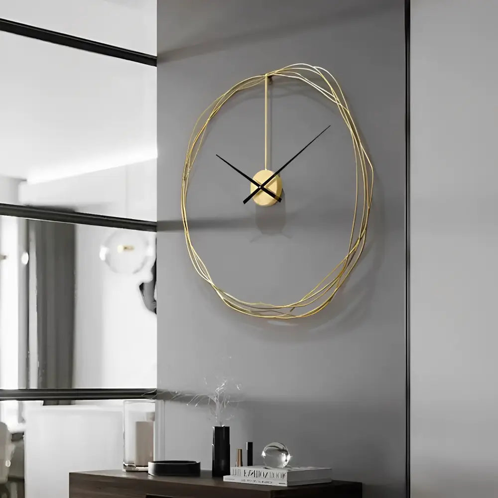 Large round gold wall clock hanging in a modern living room