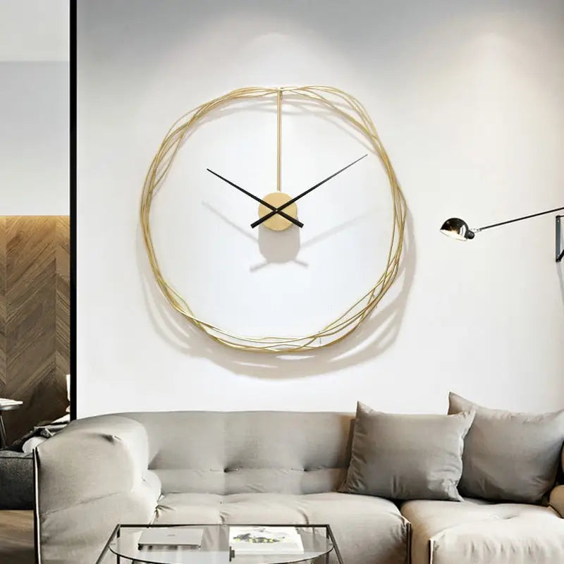 Minimalist gold circle clock in a contemporary bedroom setting