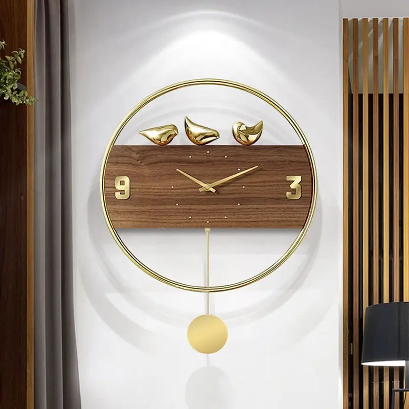 Close-up of 3D perched bird details on gold vintage wall clock