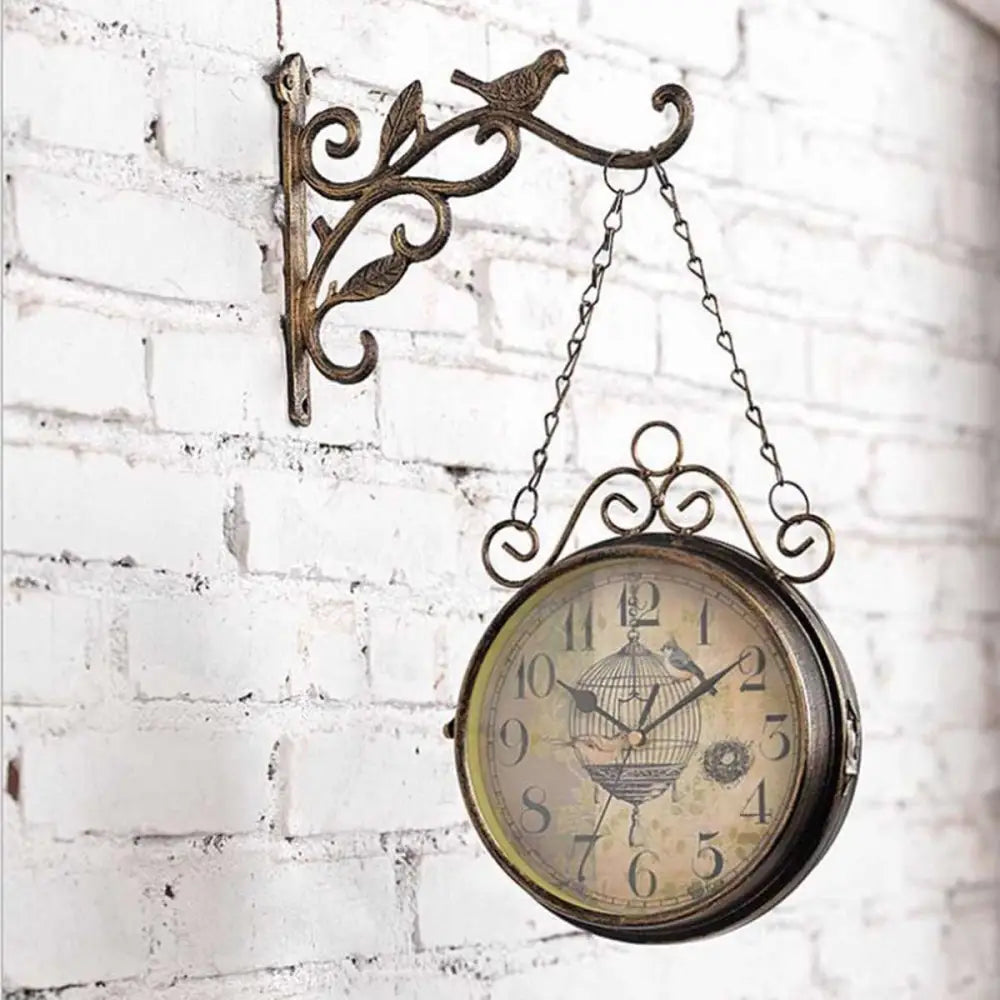 Close-up of metal bird cage clock face showing analog numerals
