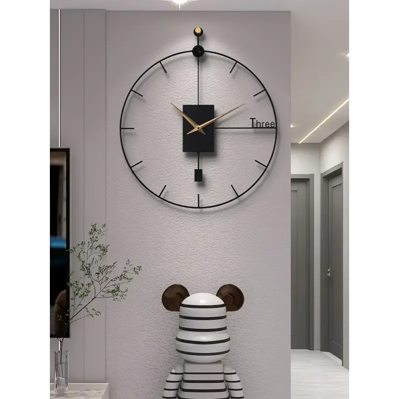 Side view of black metal wall clock showing frame depth