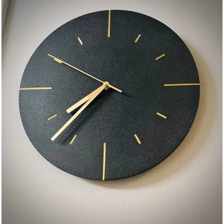 White cement look wall clock displayed in modern living room