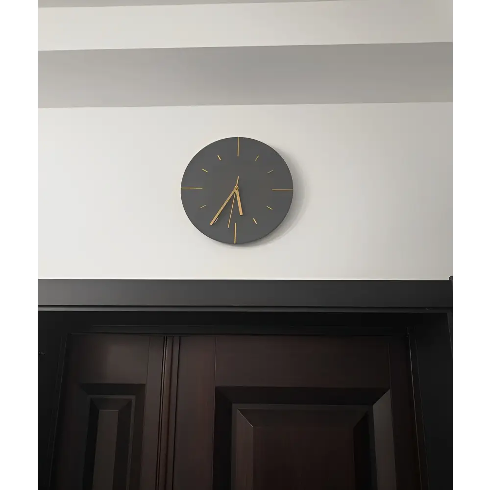 Three color variants of the CasaClock cement look wall clock side by side