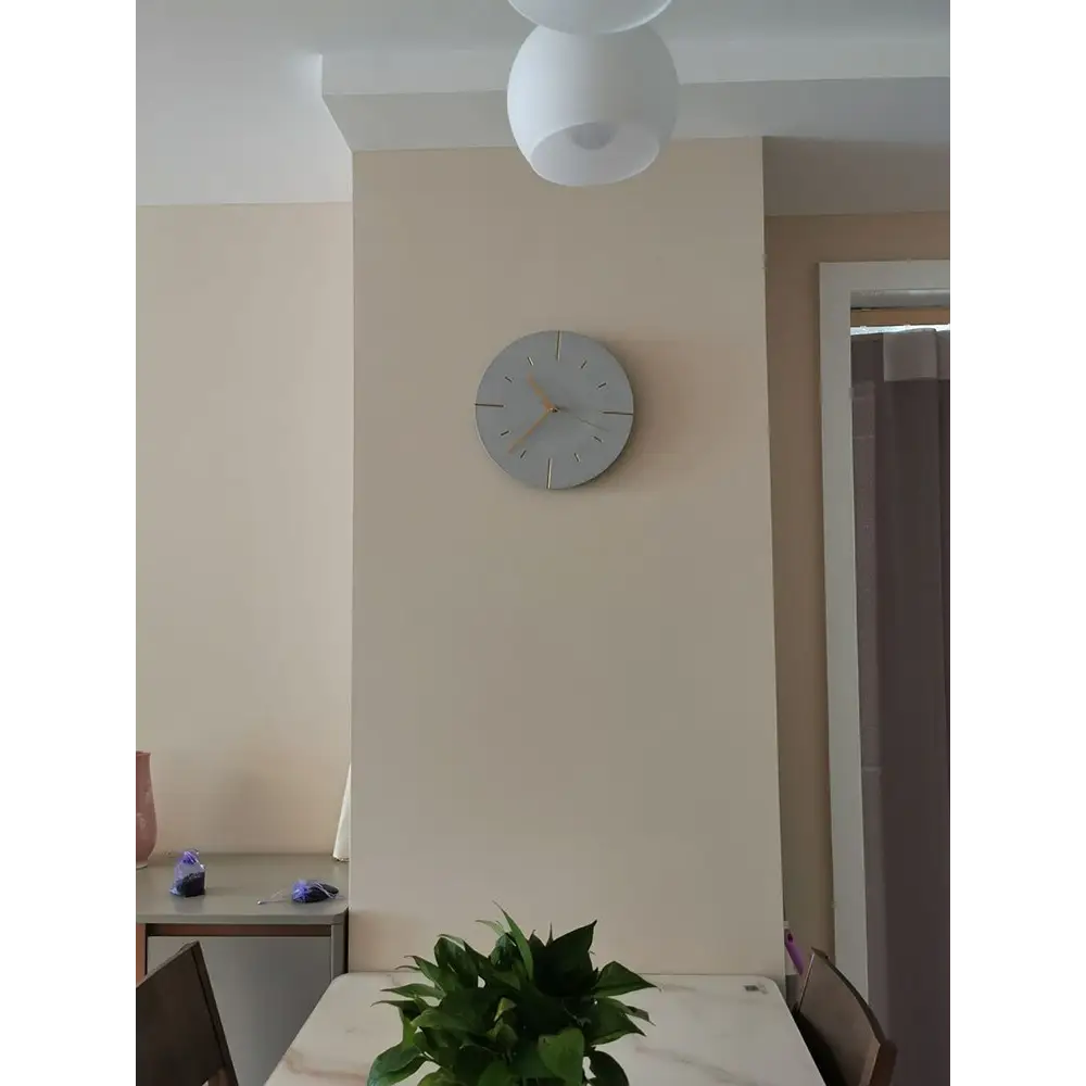 Cement look wall clock analog hands detail shot
