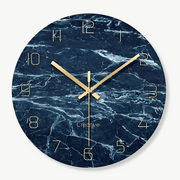 Designer glass wall clock with subtle crystal pattern on white wall