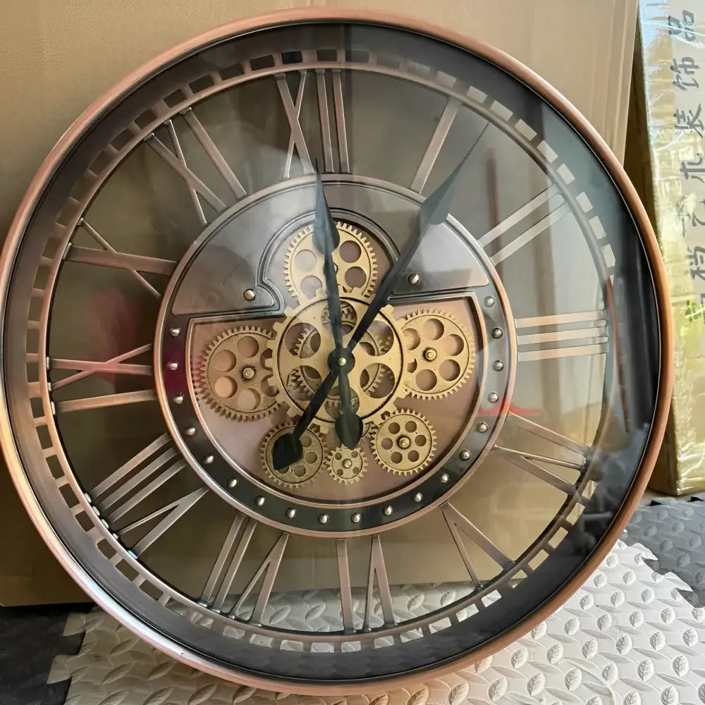 Close-up of reinforced mineral glass mirror dial on industrial wall clock