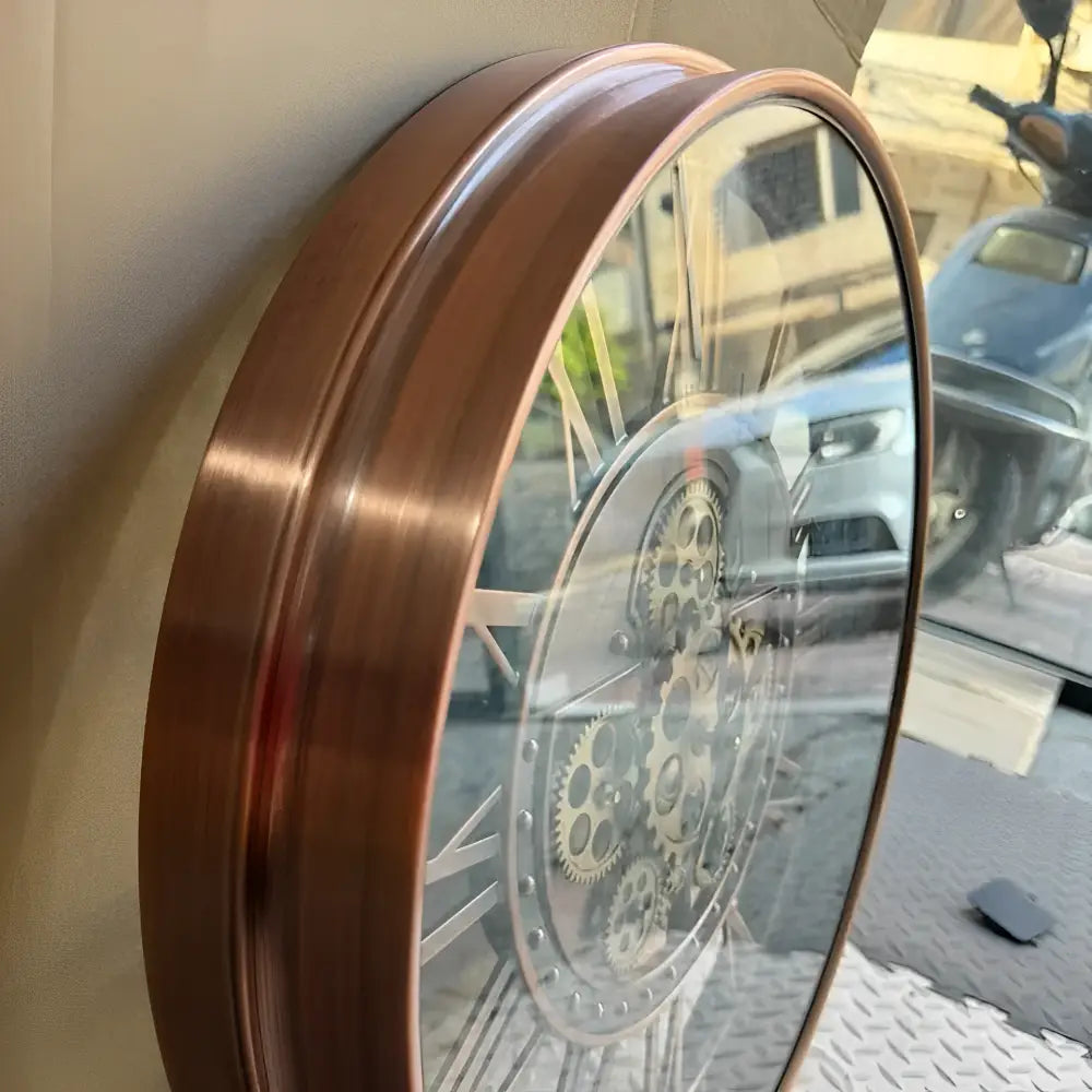 Industrial mechanical wall clock showing analog hands and quartz movement detail