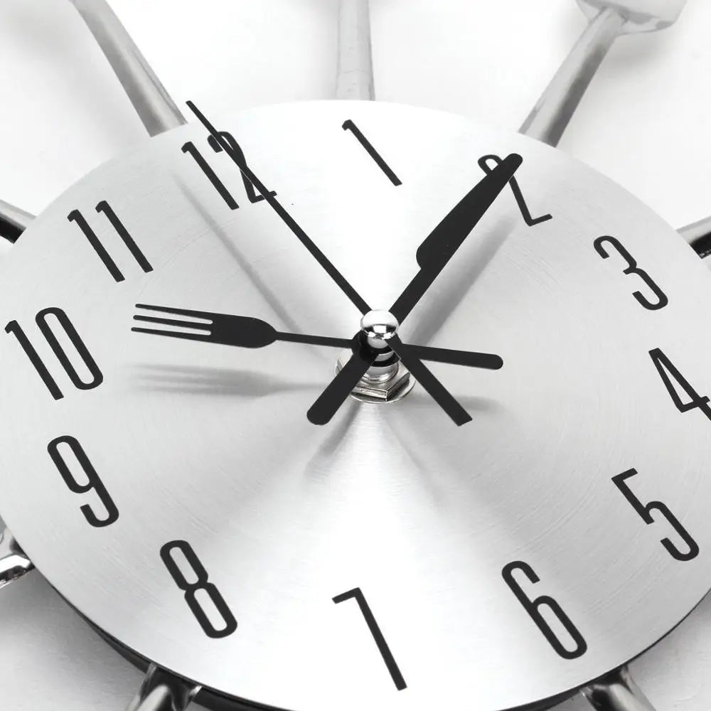 Red metal wall clock mounted in modern kitchen