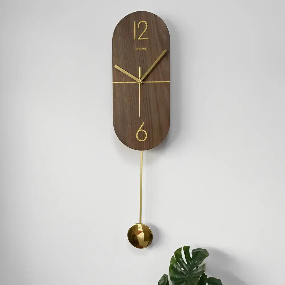 Close-up of solid walnut wood body and gold accents on the Linea wall clock