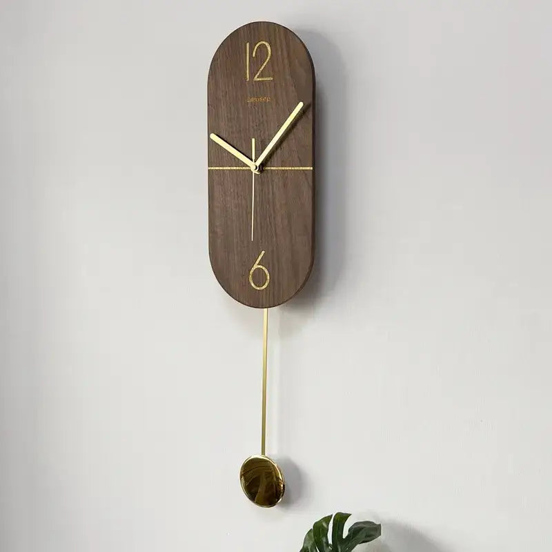 Side profile of the Linea 61.6 cm walnut wood wall clock showing slim design