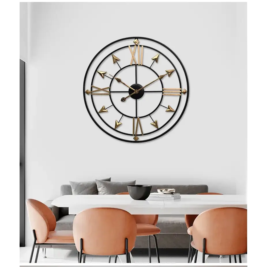 gold metal wall clock with intricate frame detail
