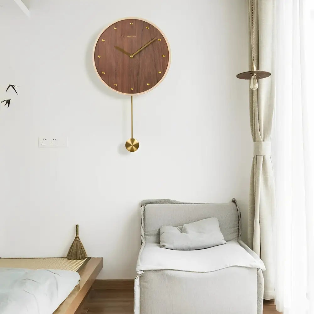 Pendulum wall clock displayed in a minimalist living room