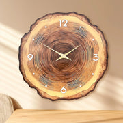 Natural wood wall clock with silent quartz movement hanging on a white wall