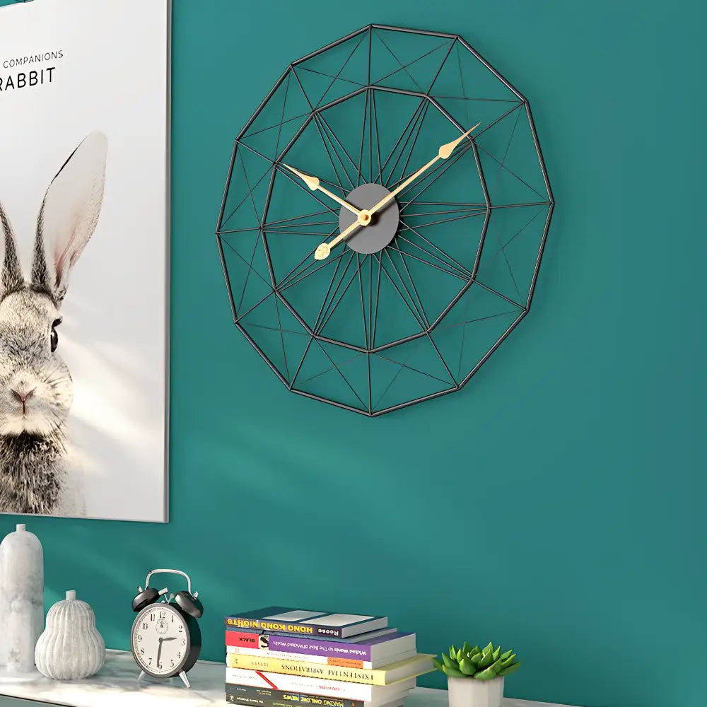 Large round abstract metal wall clock gold frame black hands close-up