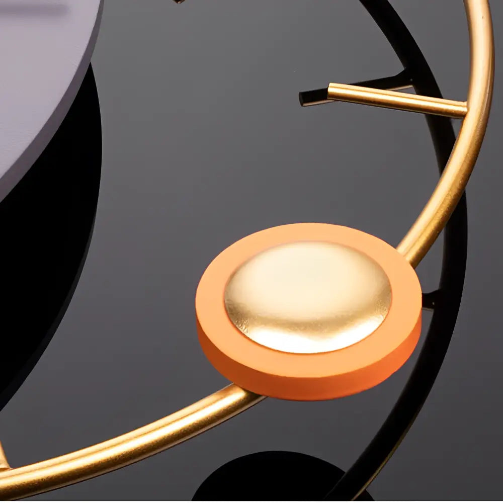 Side profile of acrylic and metal wall clock showing slim modern construction