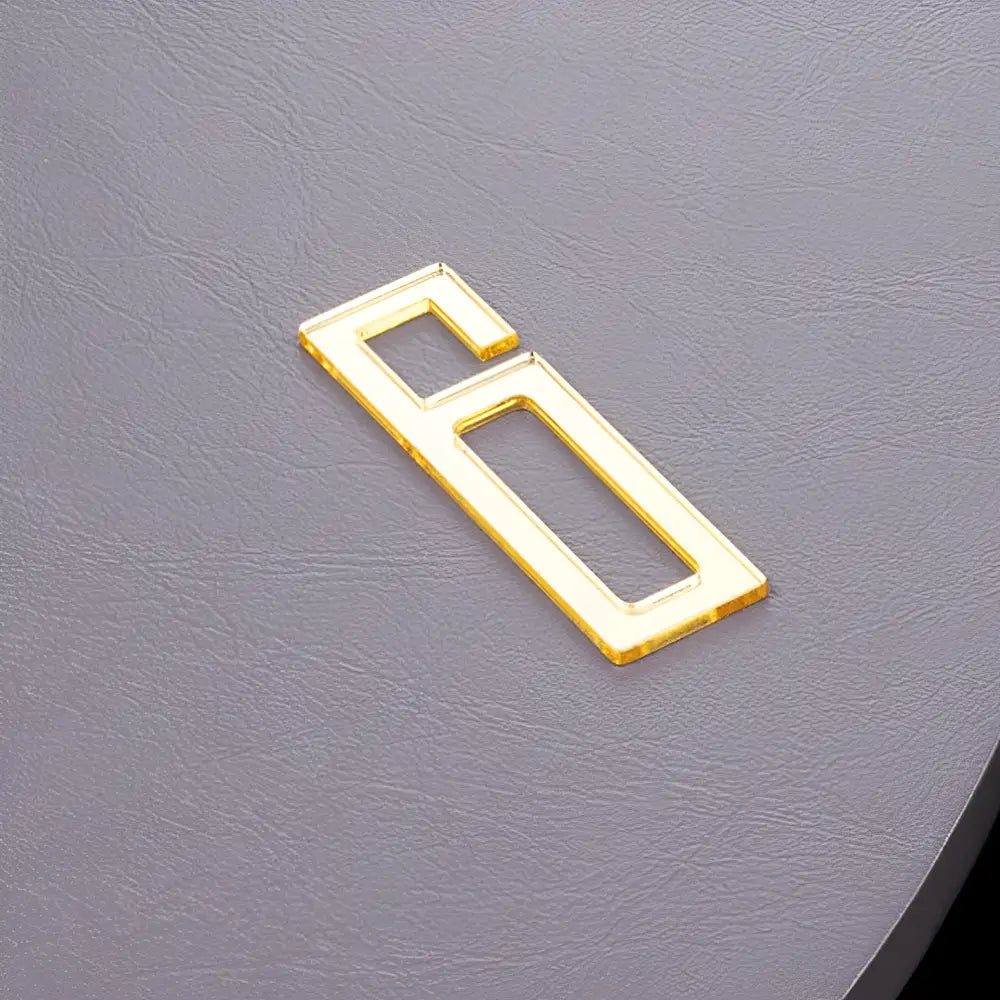 Abstract wall clock as a statement piece above a minimalist sofa