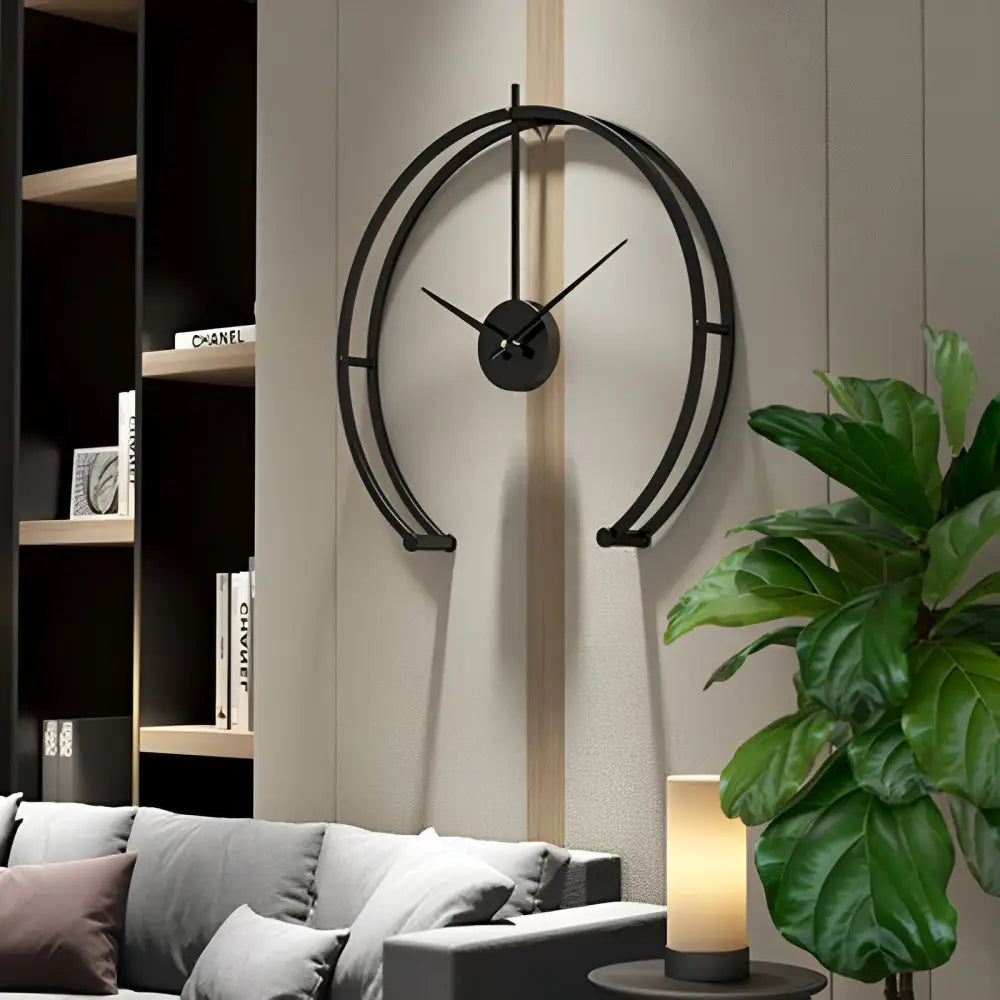 Gold open circle wall clock with slim hands on a white living room wall