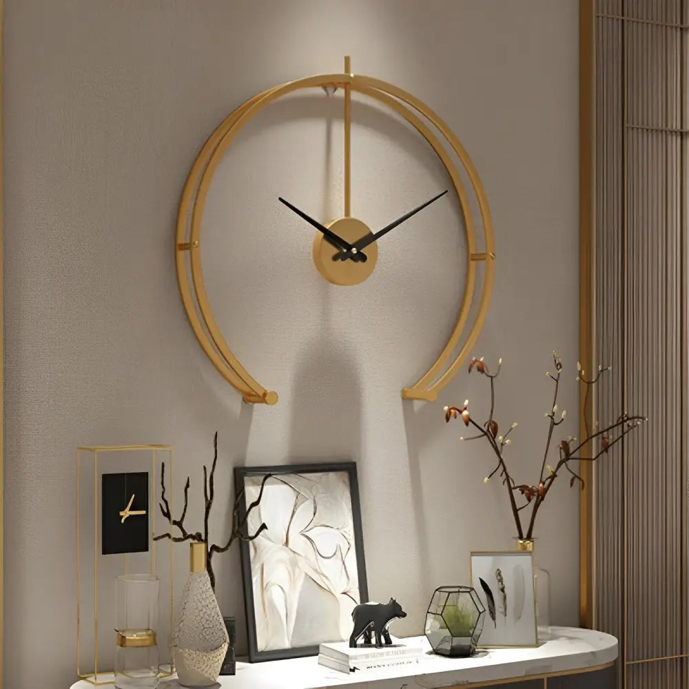 Black and gold open circle wall clock size comparison on a neutral wall