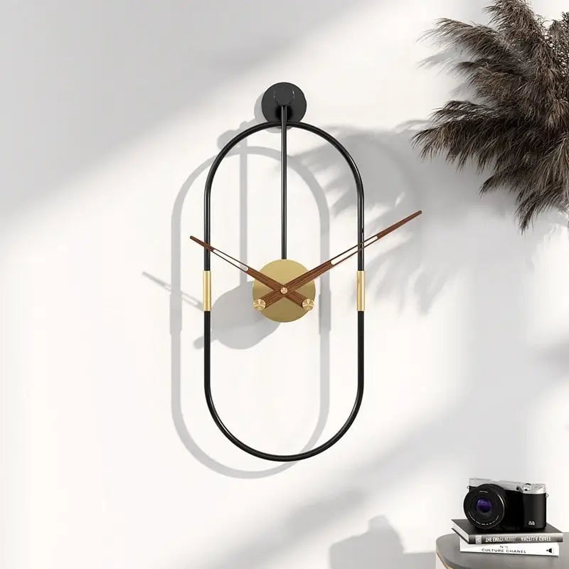 Close-up of silent analog hands on oval metal wall clock