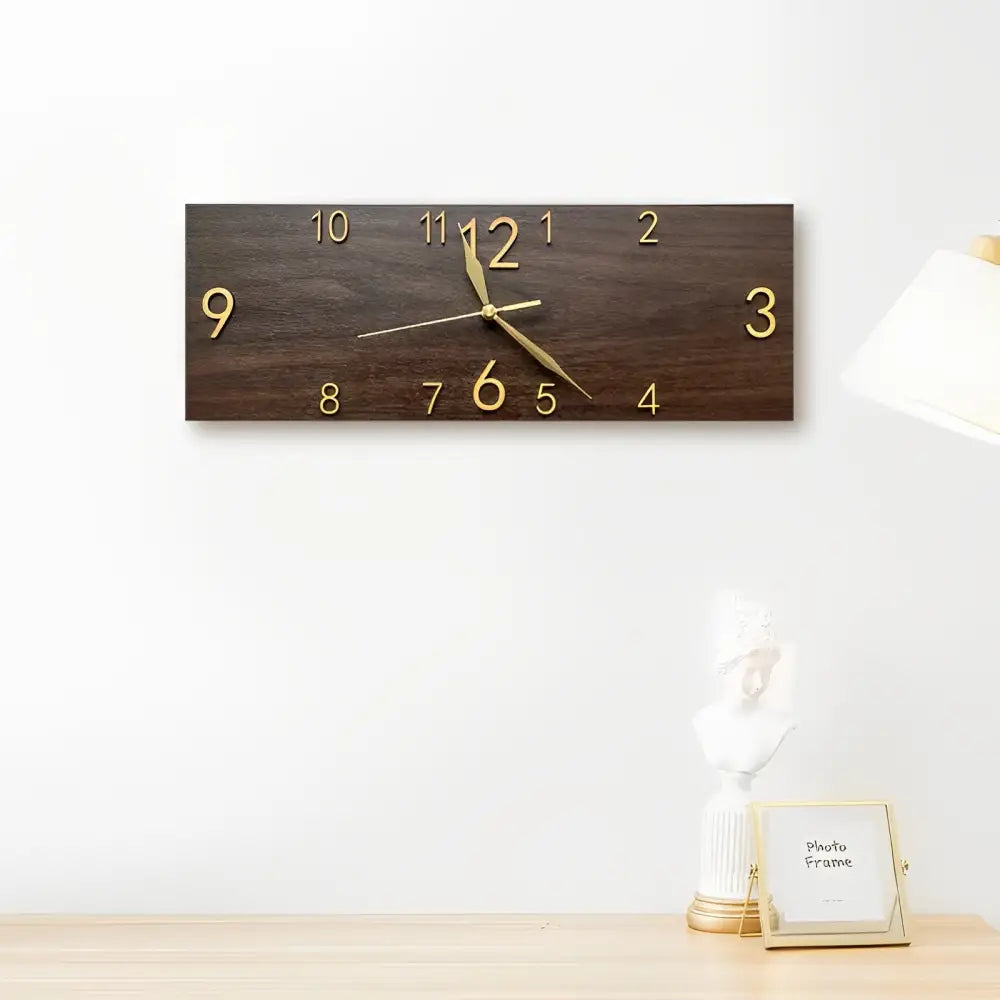 Close-up of acrylic numerals on a PVC wood-grain rectangular wall clock