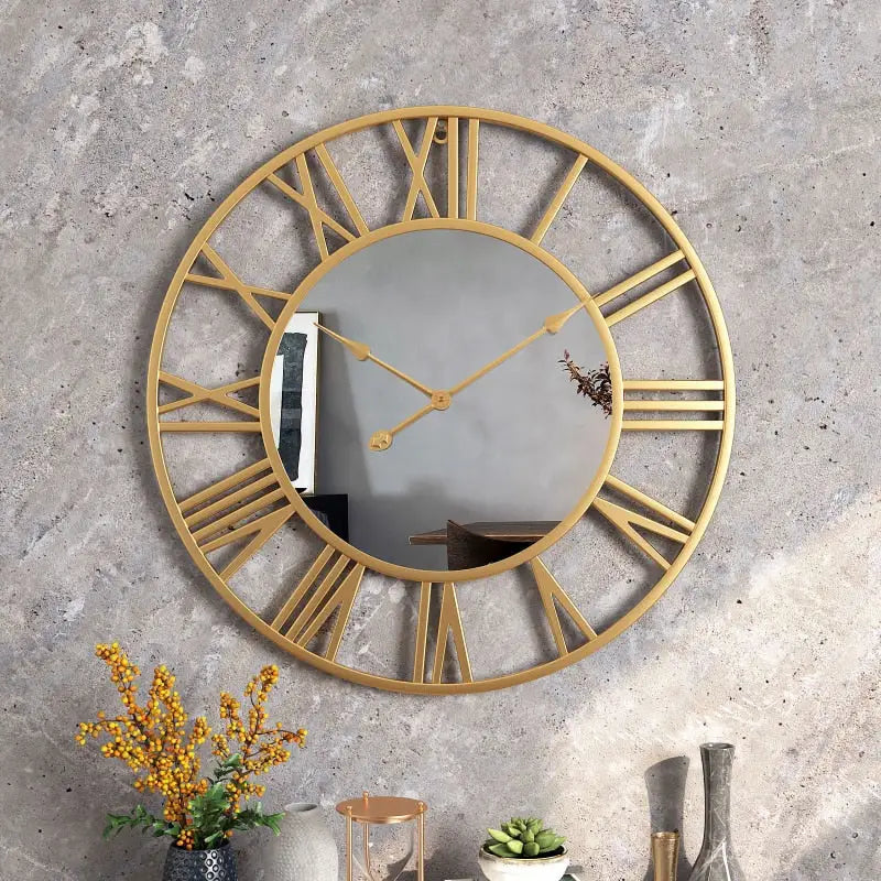 Close-up of analog hands and Roman numeral markers on metal mirror wall clock