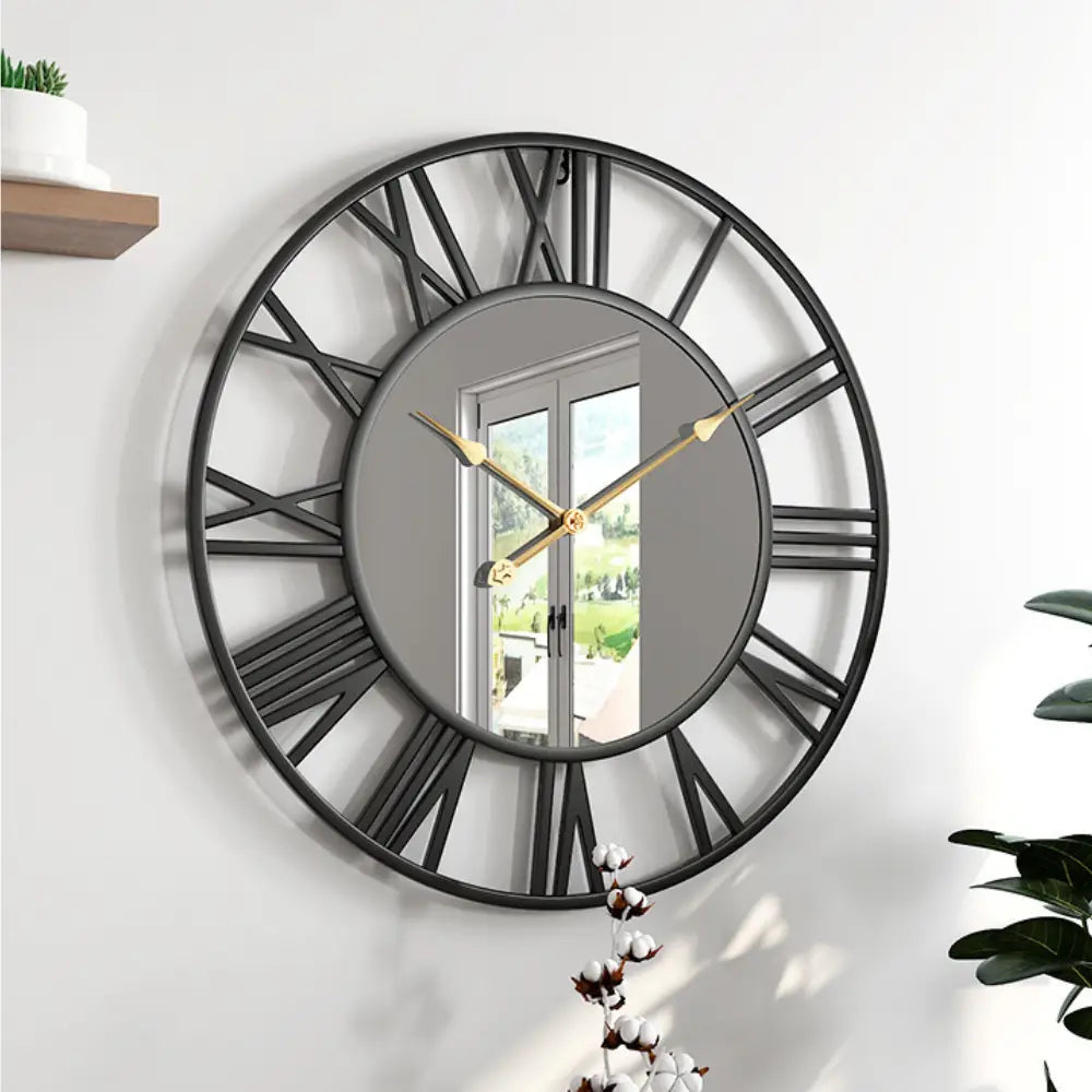 Black mirror wall clock reflecting natural light in a modern bedroom