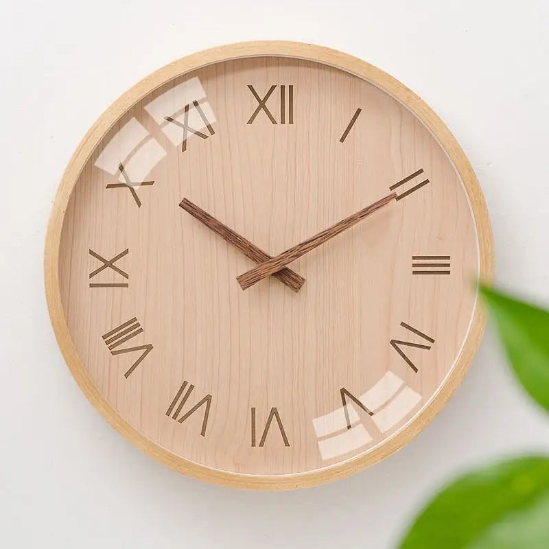 Close-up of wooden clock dial with Roman numerals and analog hands
