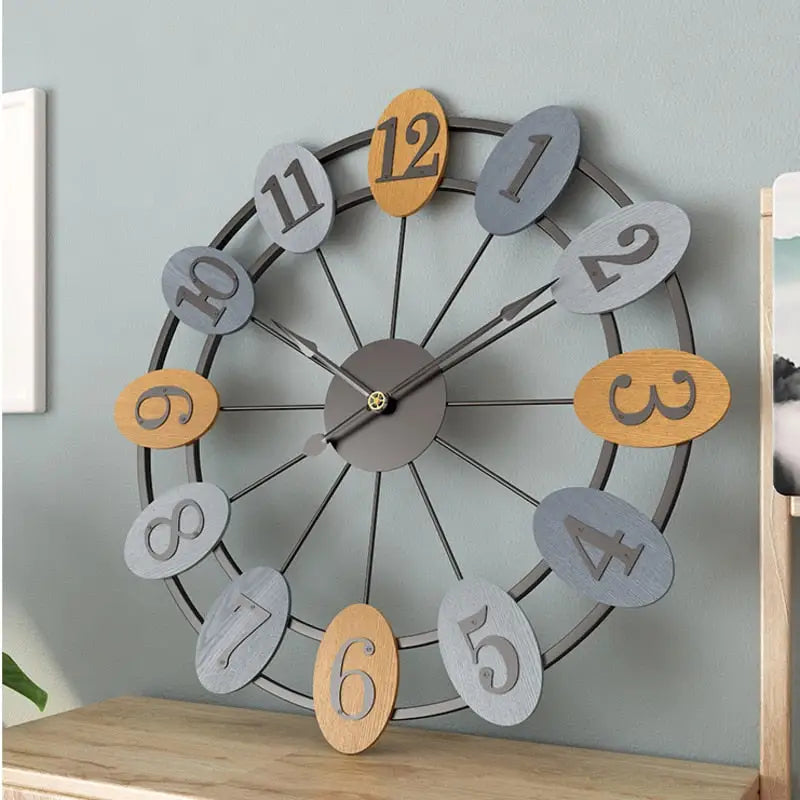 Close-up of analog hands and artistic dial on industrial metal wall clock