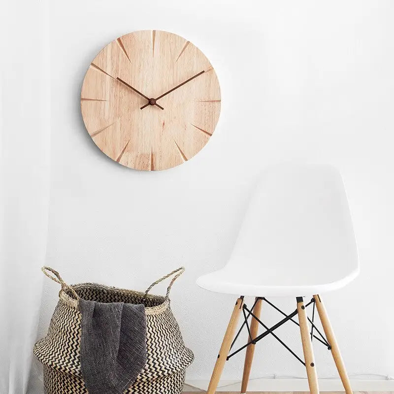 Circular wooden wall clock with analog needle display on white wall