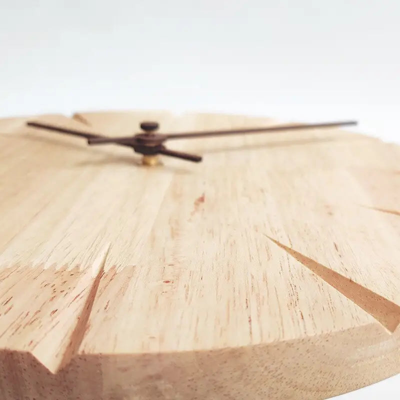 Close-up of carved wood clock face with silent movement