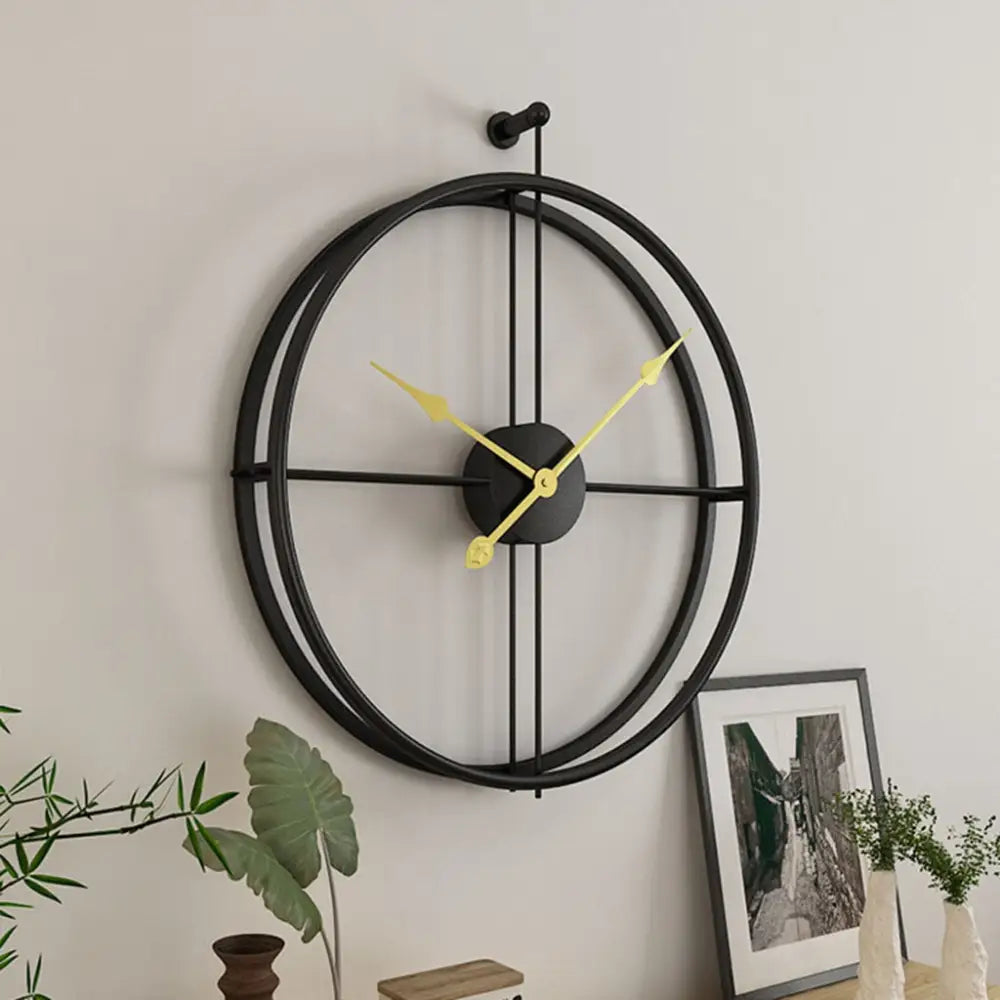 Retro metal wall clock with spherical ring design in gold finish