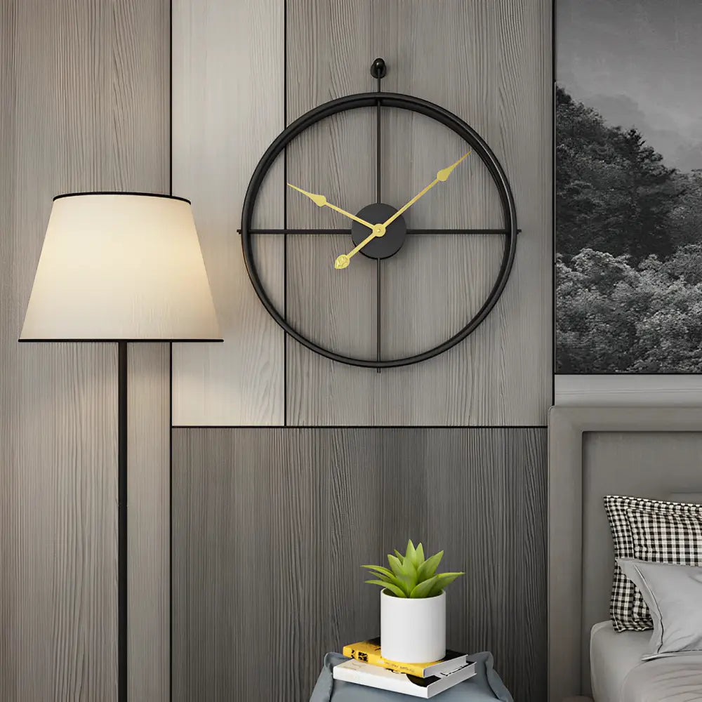 Close-up of silent quartz analog hands on spherical rings wall clock