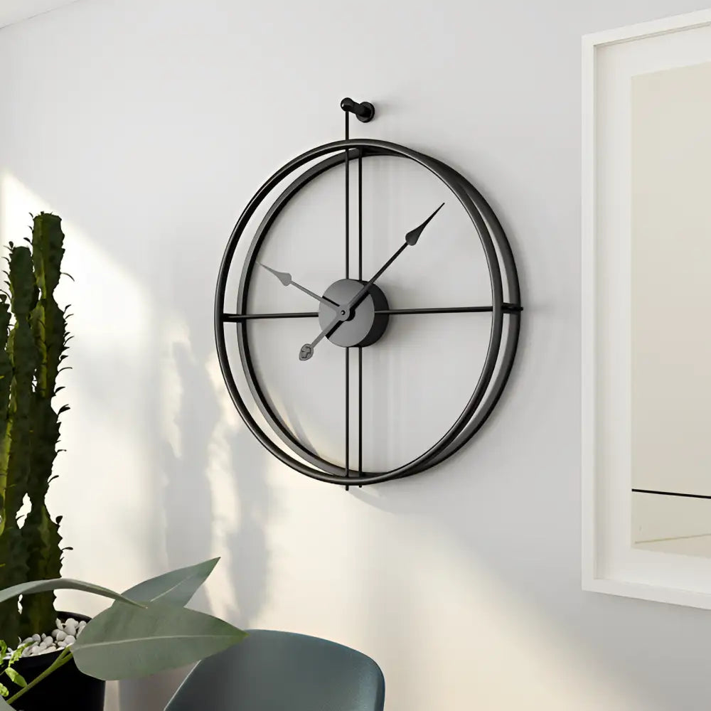 Spherical rings wall clock in silver mounted on living room wall